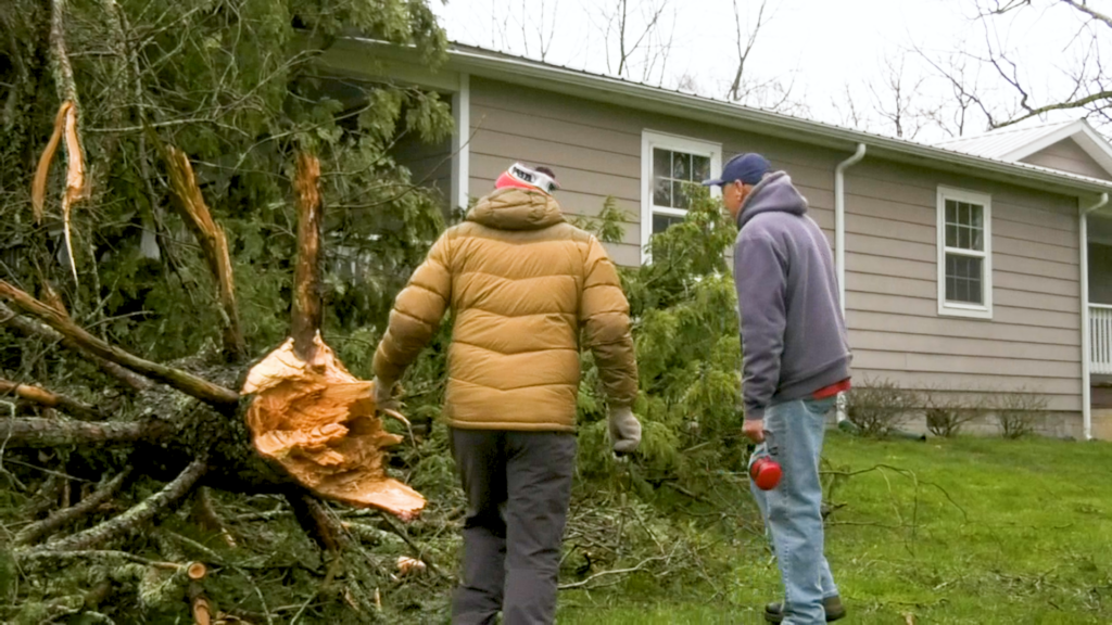 Tornado leaves Fayetteville homeowner with giant tree on house